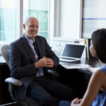 Doctor In Consultation With Female Patient In Office